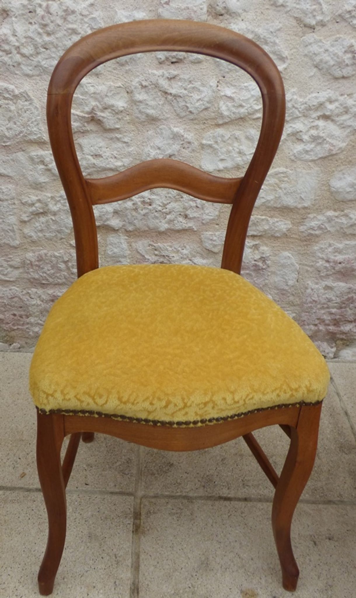 Louis Philippe period chair trimmed with yellow velvet in wood