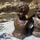 Pair of antique cast iron fire dogs "The Conquering Love"