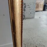 Long wooden mirror and gilded stucco with pearl rays H: 2m45 L: 40cm