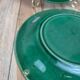Set of 2 green earthenware dessert plates with vine decoration.