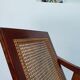 Paire de fauteuils en teck rouge et cannage