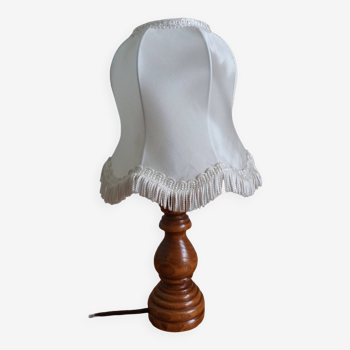 Turned wood lamp with fabric lampshade