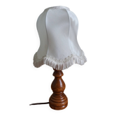Turned wood lamp with fabric lampshade