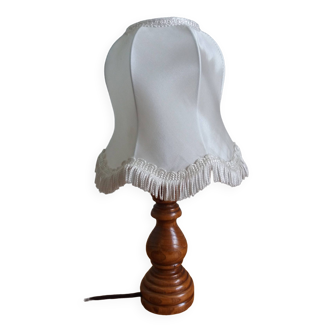 Turned wood lamp with fabric lampshade