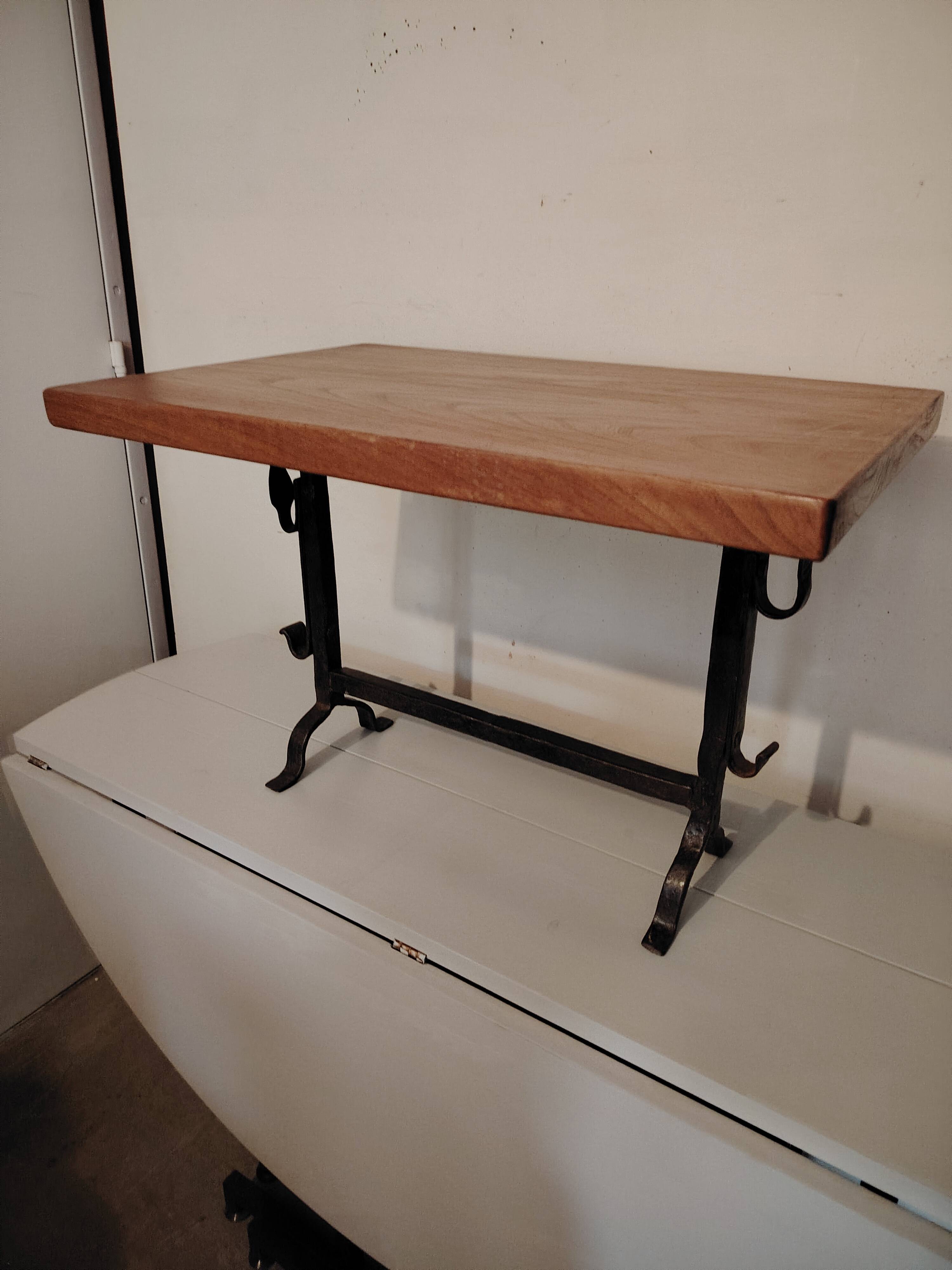 Solid wood and wrought iron coffee table