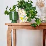 Antique coffee table with curved legs.