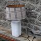 White ceramic lamp with tartan shade – cozy and timeless style