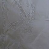 Old sheet with hand made embroidery, shaped flowers.