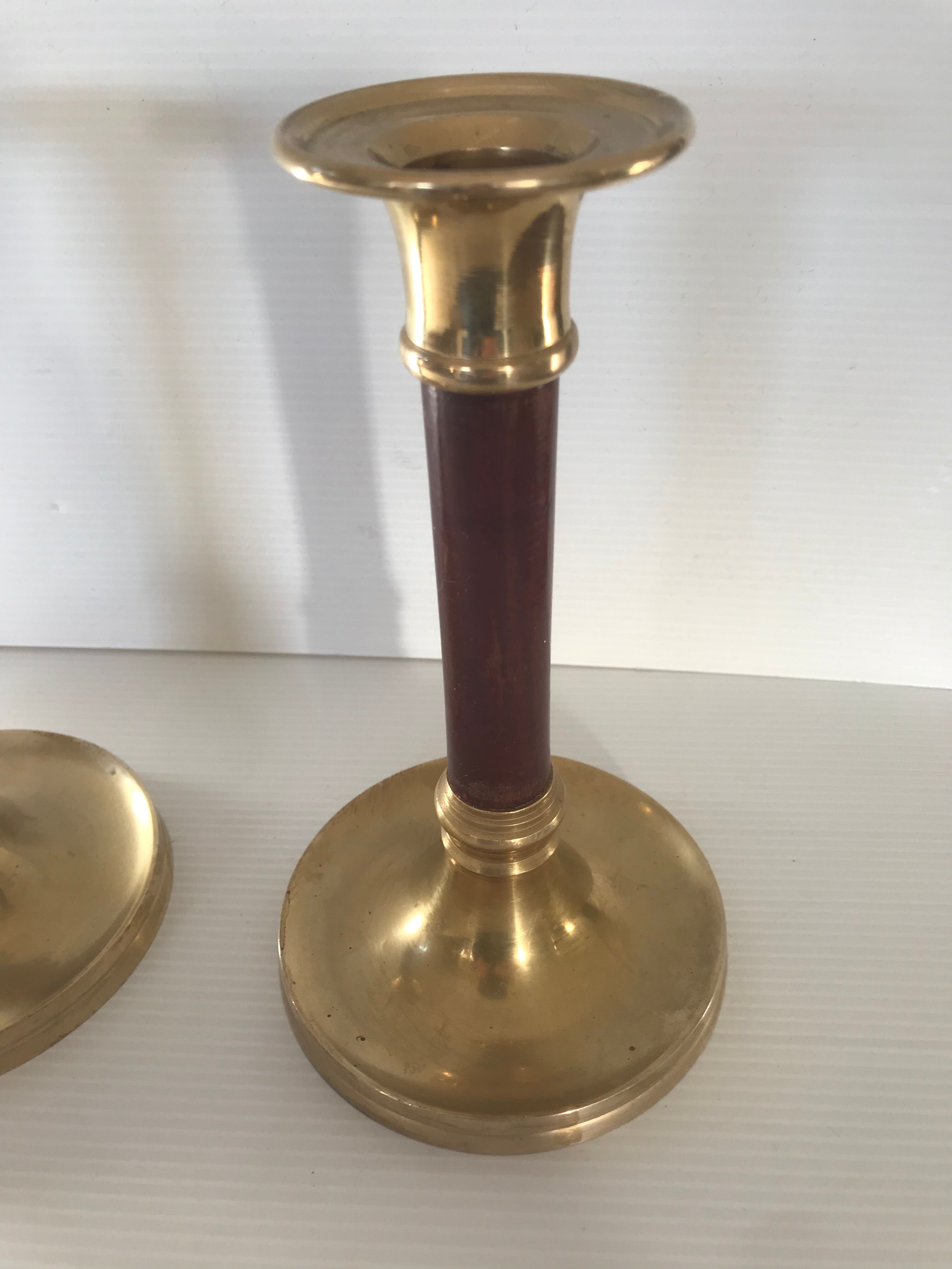 Pair of Scandinavian brass and teak candle holders