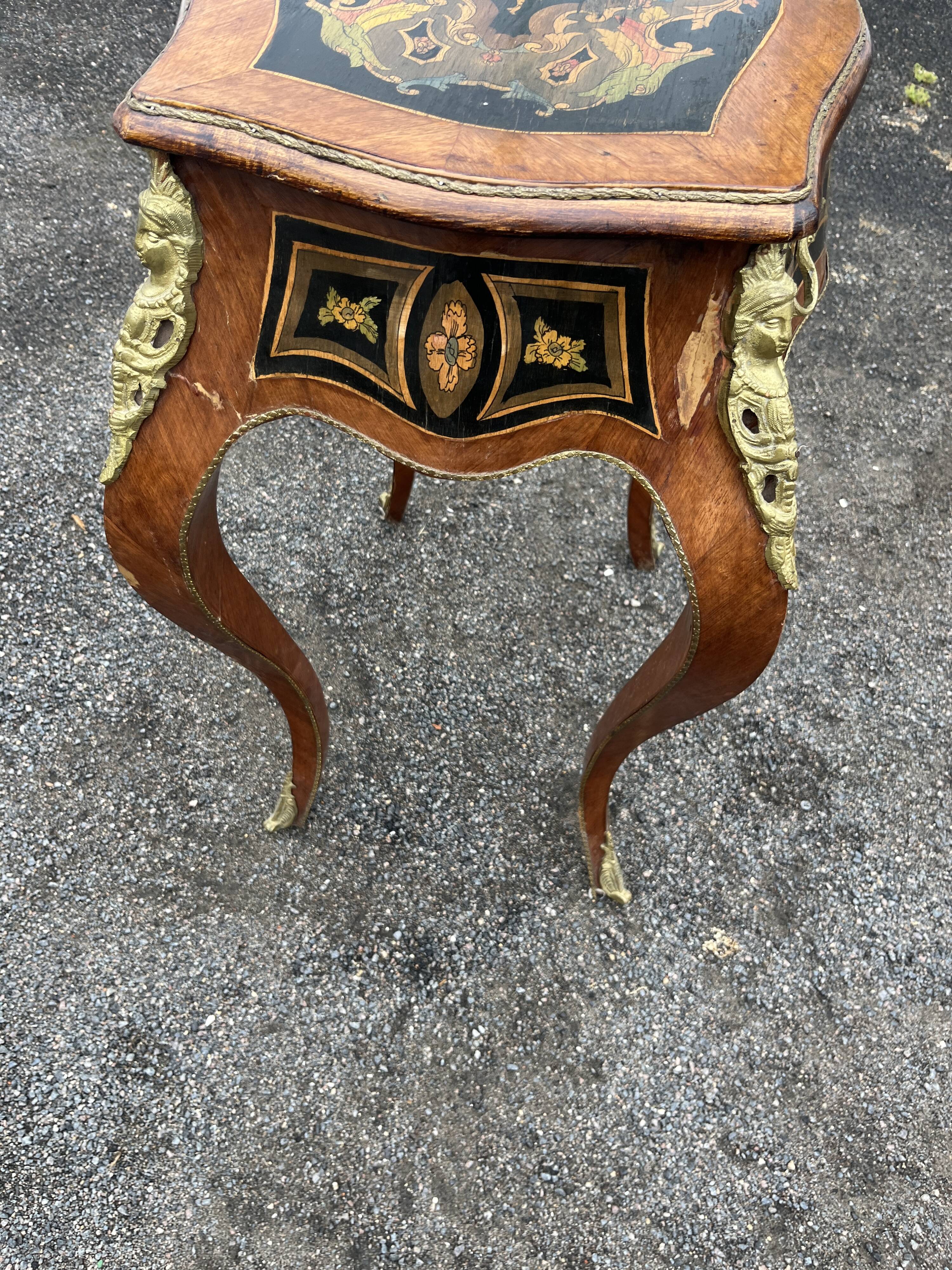Louis XV style side table with marquetry and gilded bronze.