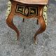 Louis XV style side table with marquetry and gilded bronze.