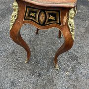 Louis XV style side table with marquetry and gilded bronze.