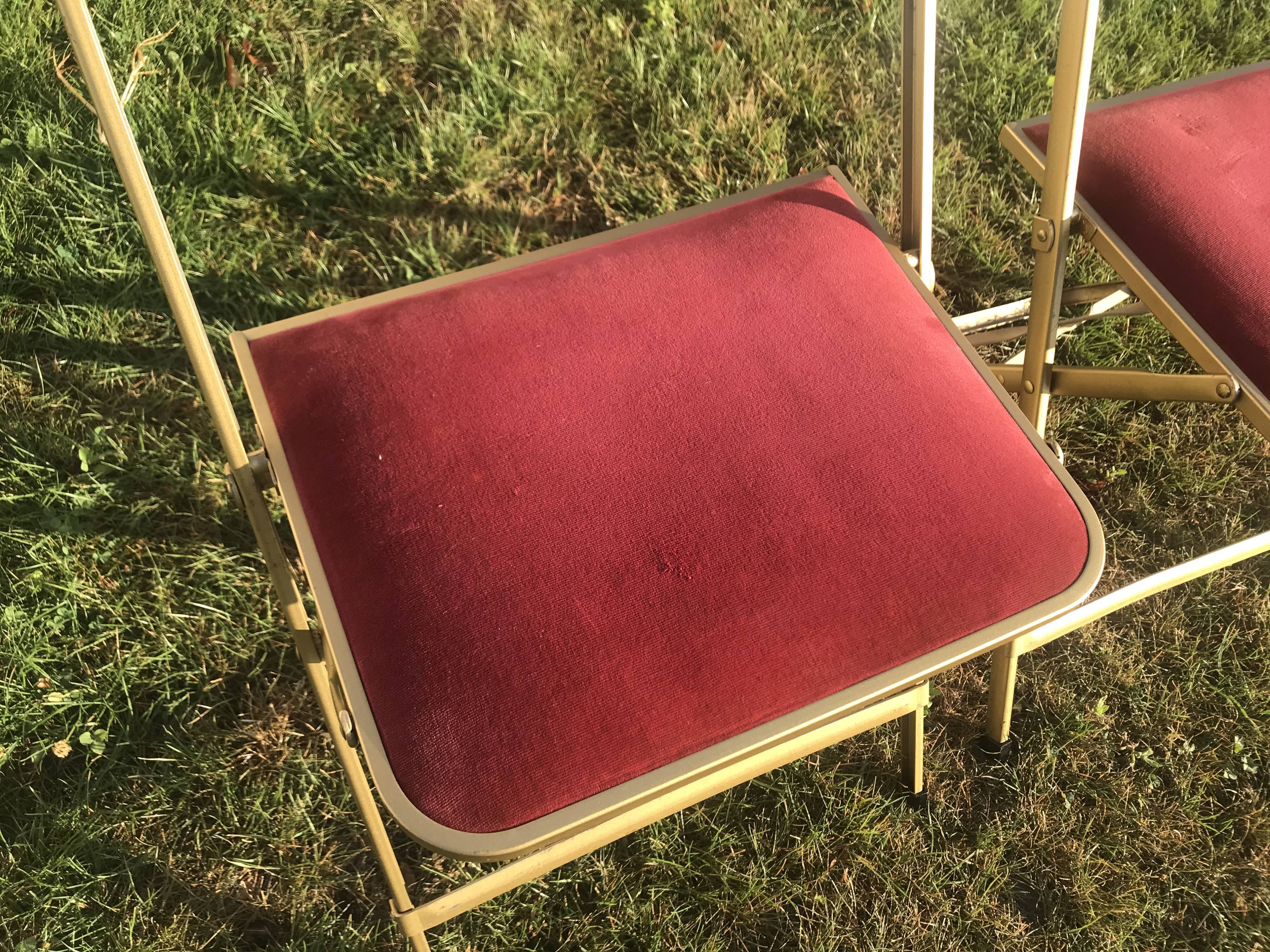 Pair of foldable red velvet chairs