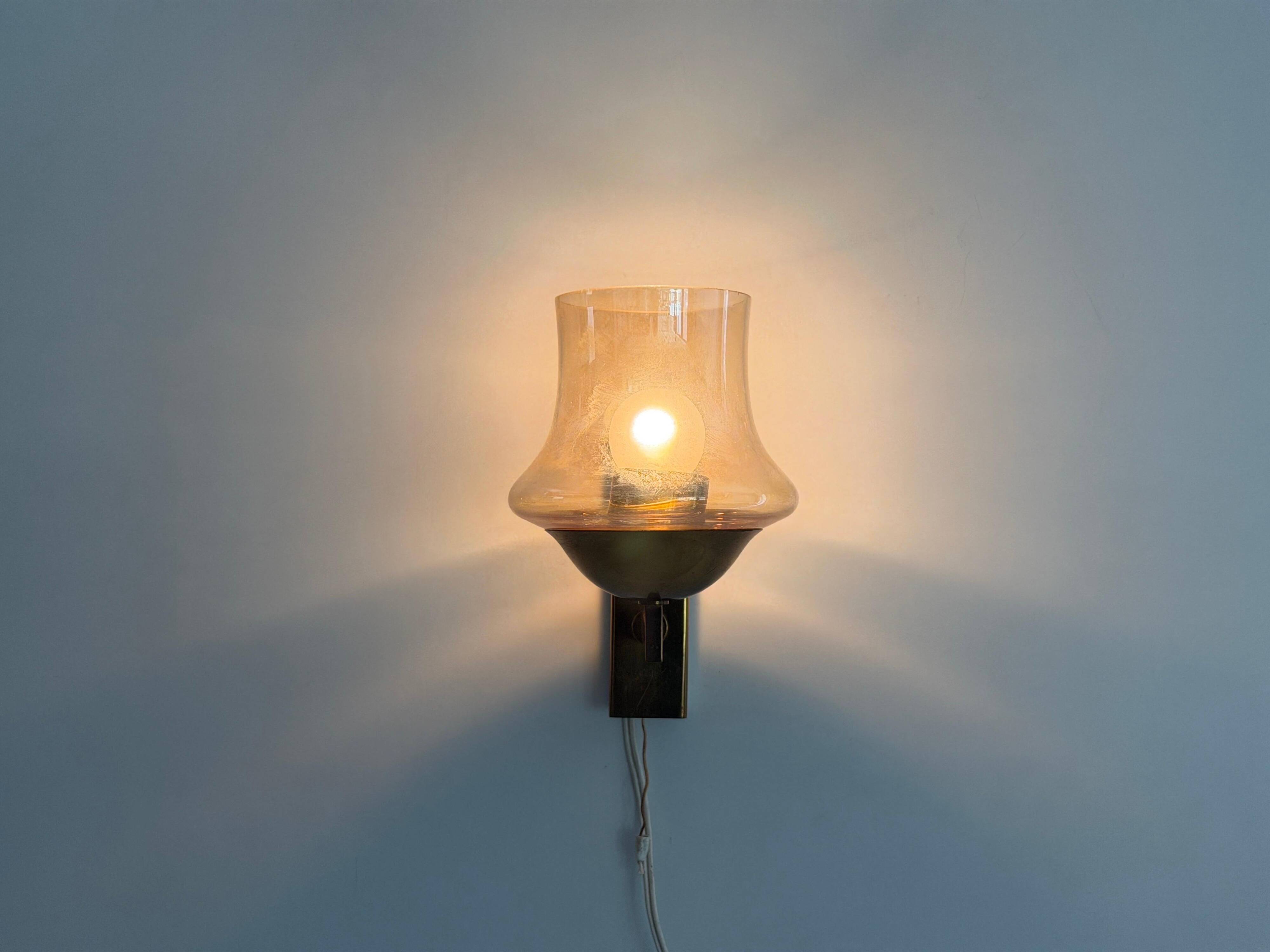 Yellow glass and brass wall light from the mid-century, 1960, Germany.