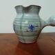 Robert and Gilberte Auguste pitcher