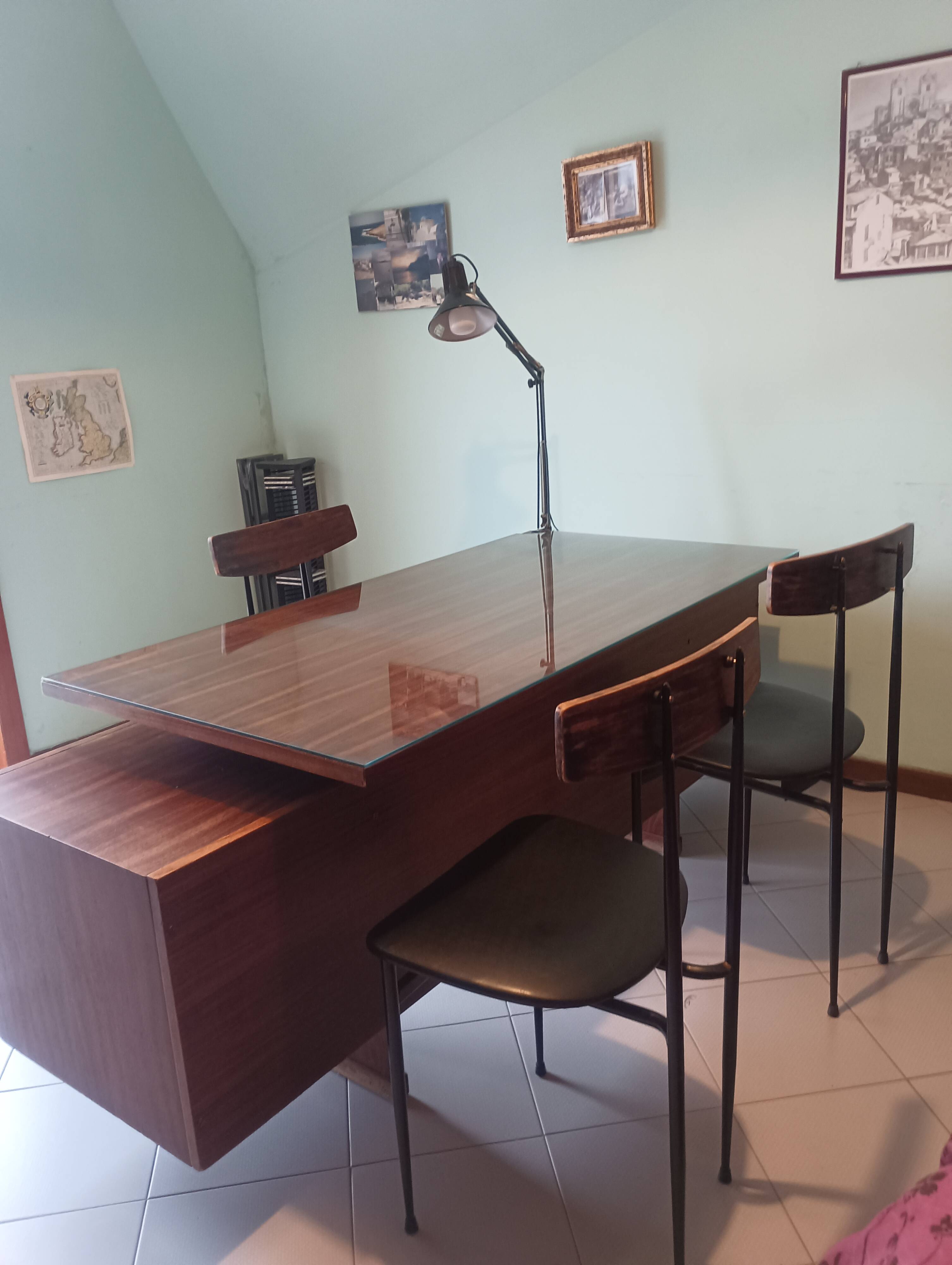 Desk and 3 chairs in 1950s Italian modernist style in rosewood.