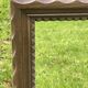 Rustic mirror called brutalist, molded carved natural wood