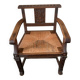 Antique armchair in carved wood with a straw seat.