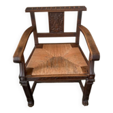 Fauteuil ancien en bois sculpté et assise en paille