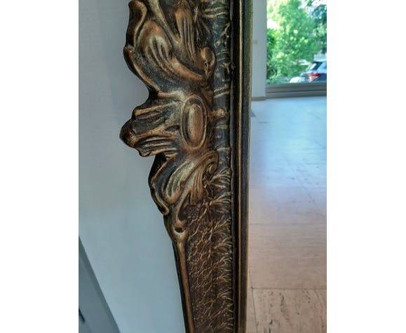 Baroque “trumeaux” mirror in carved solid wood.