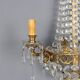 Antique wall sconces in gilded bronze with neoclassical motifs, 20th century.