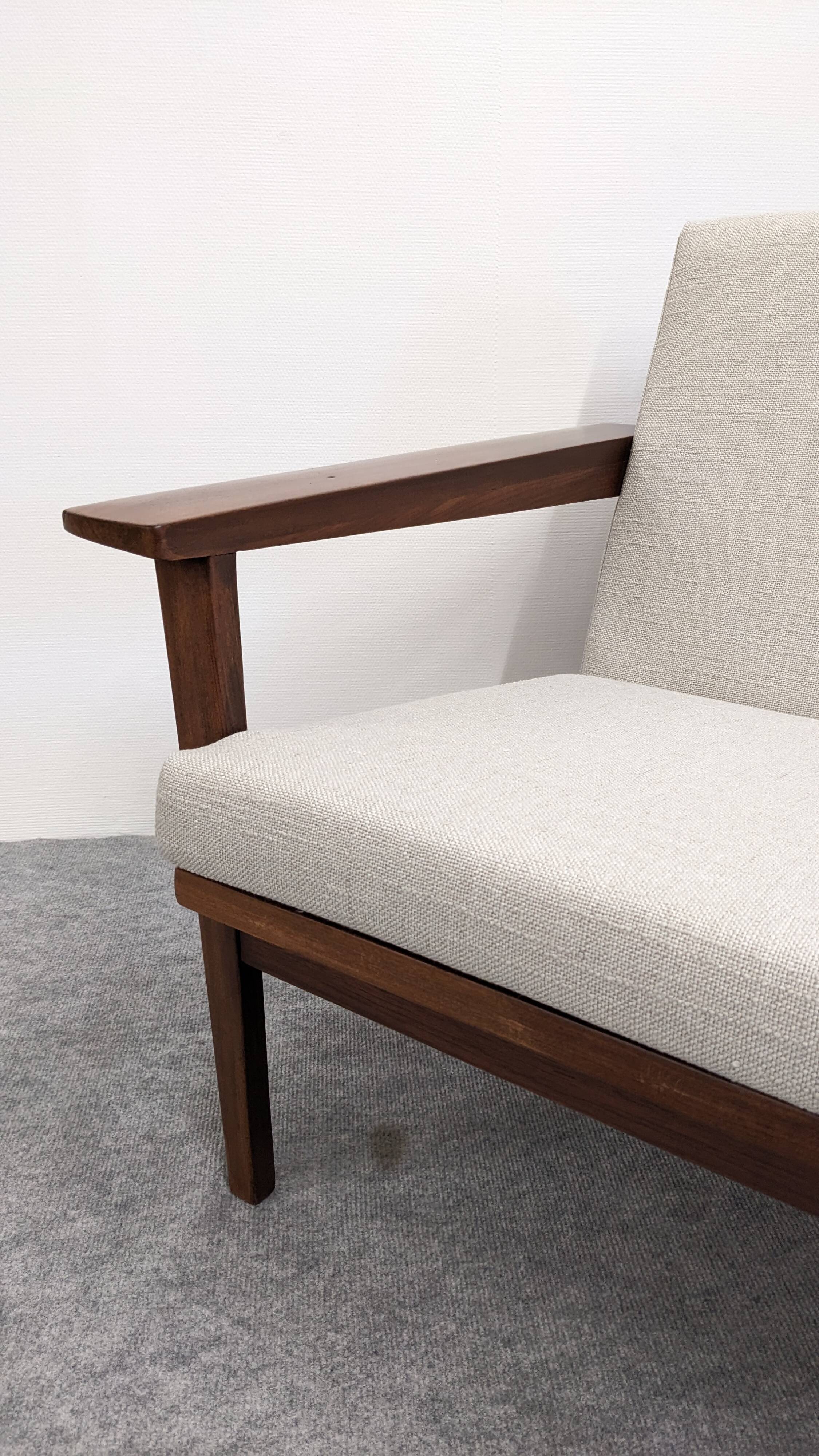 Scandinavian style three-seater sofa in teak, France circa 1950.