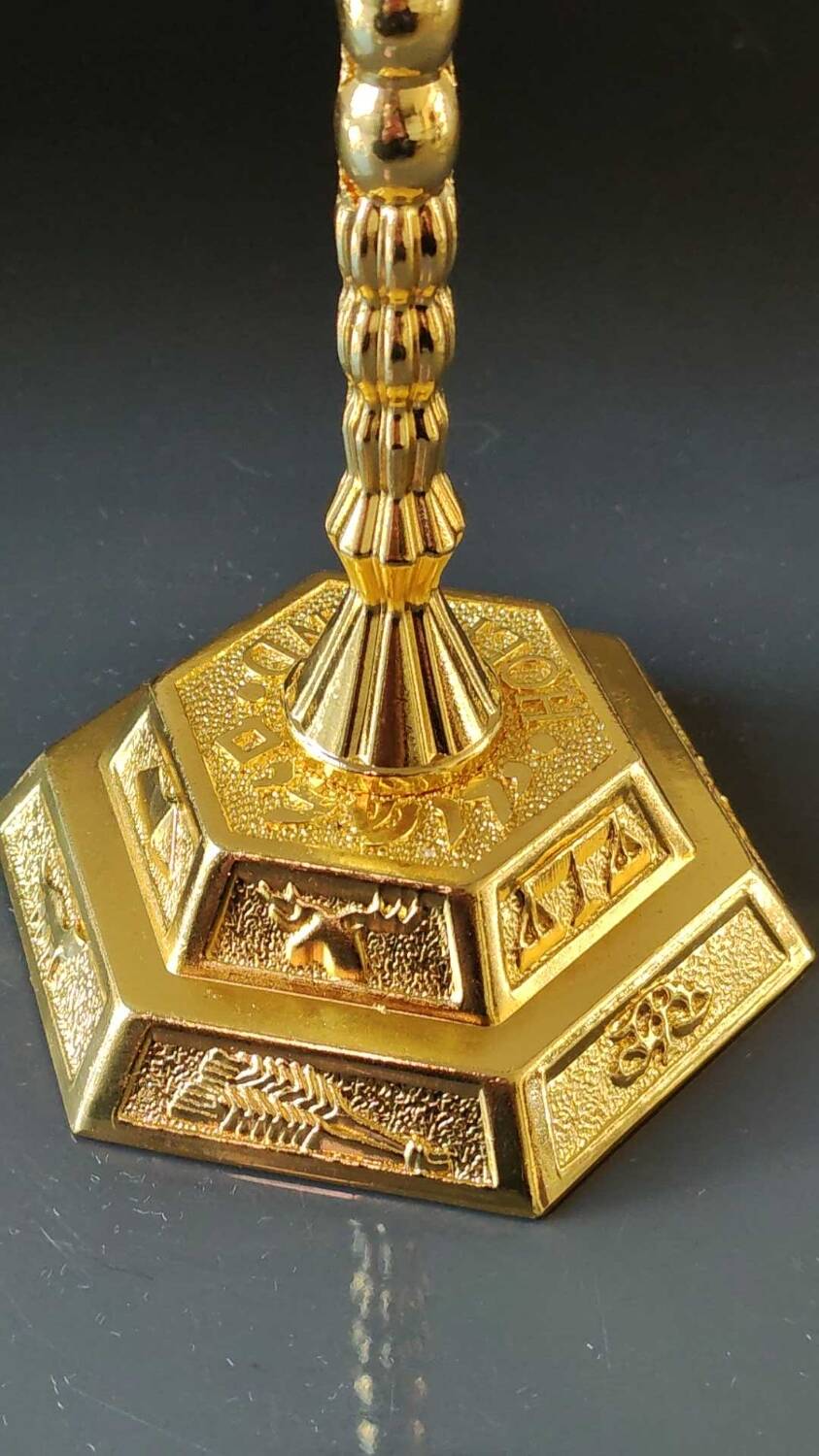 Menorah/Jewish/Hebrew candlestick with 7 arms of light. Engraved with the symbols of the 12 tribes of Israel/Holyland inscription. In gold metal. Size 20 x 16 cm
