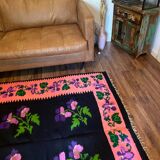Oltenian floral rug handwoven in wool, purple flowers on black and pink background