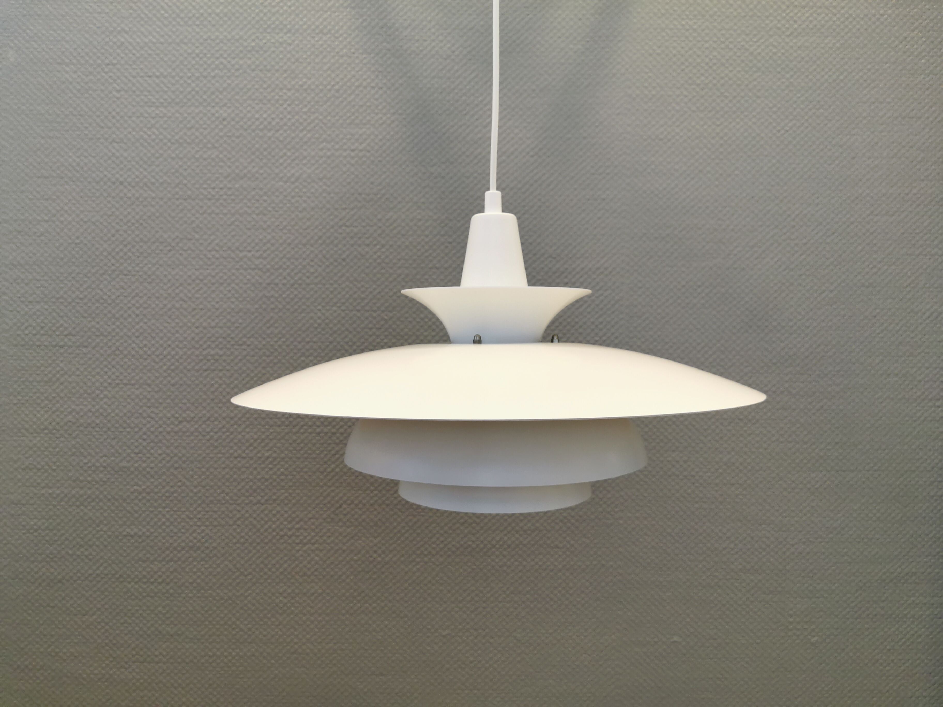 Classic danish designed hanging lamp from the 80s, in white lacquered metal