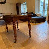 Oval drop-leaf table