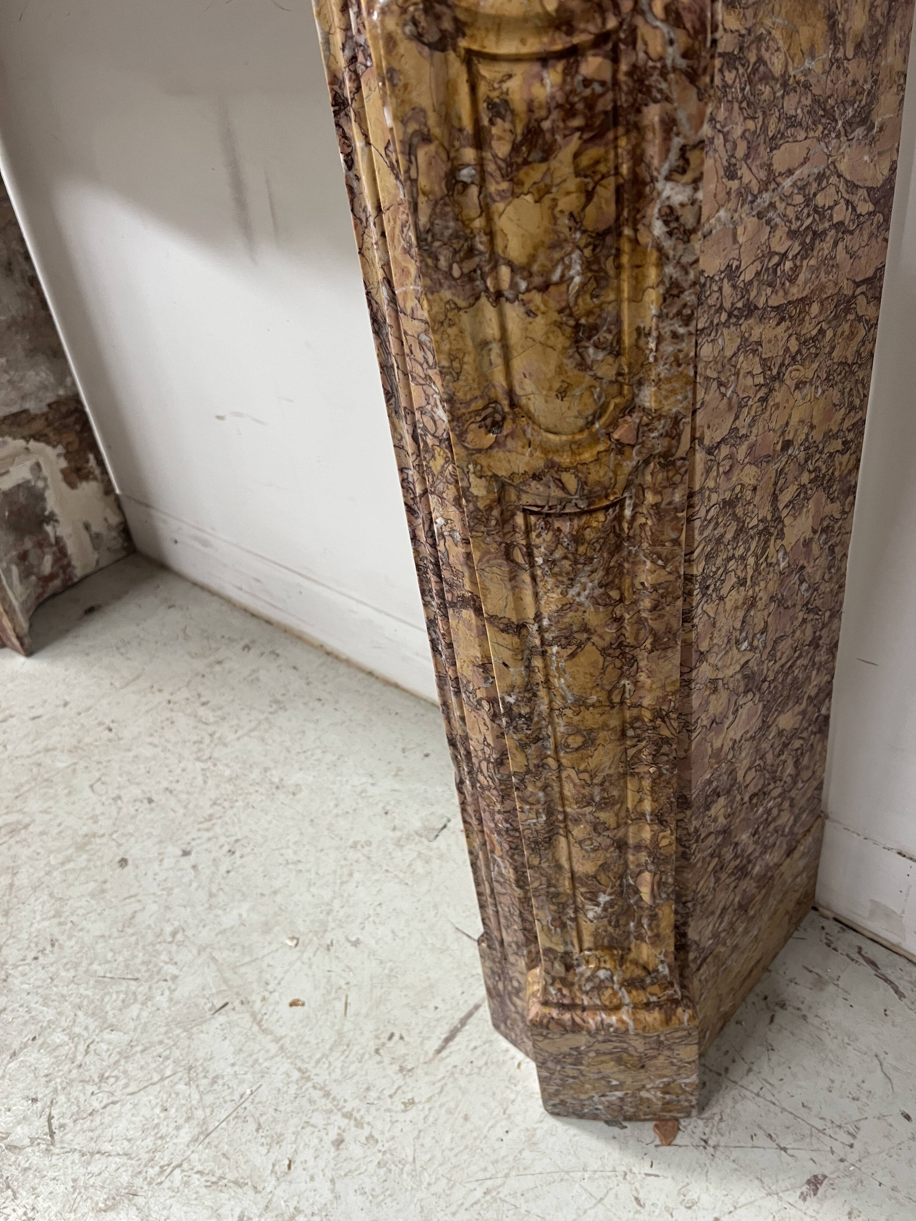 Louis XV style fireplace, Pompadour model, speckled breccia marble, 19th century