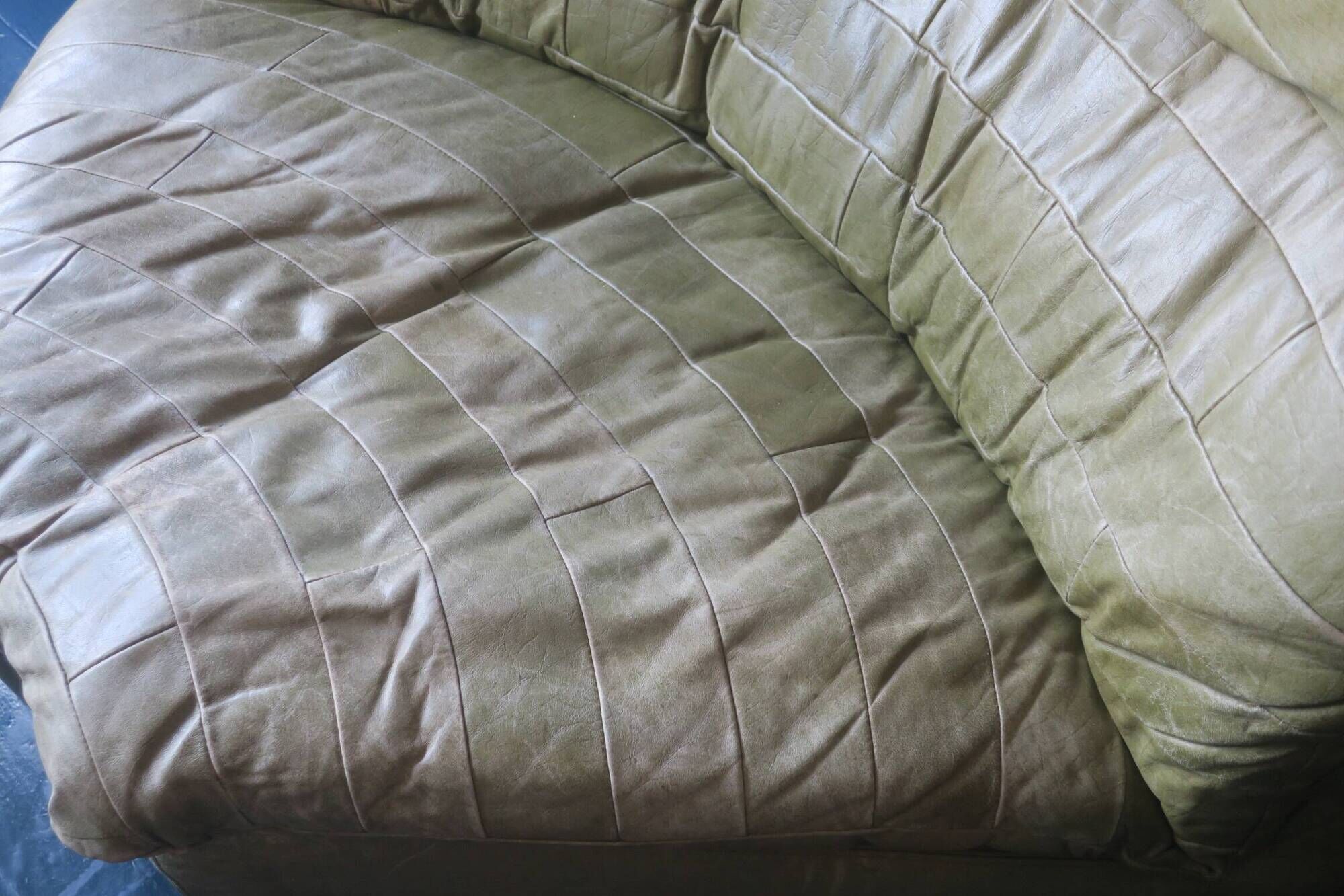 Patchwork large olive green leather corner lounge chair by Laauser, 1970s