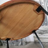 Round coffee table in walnut veneer and metal