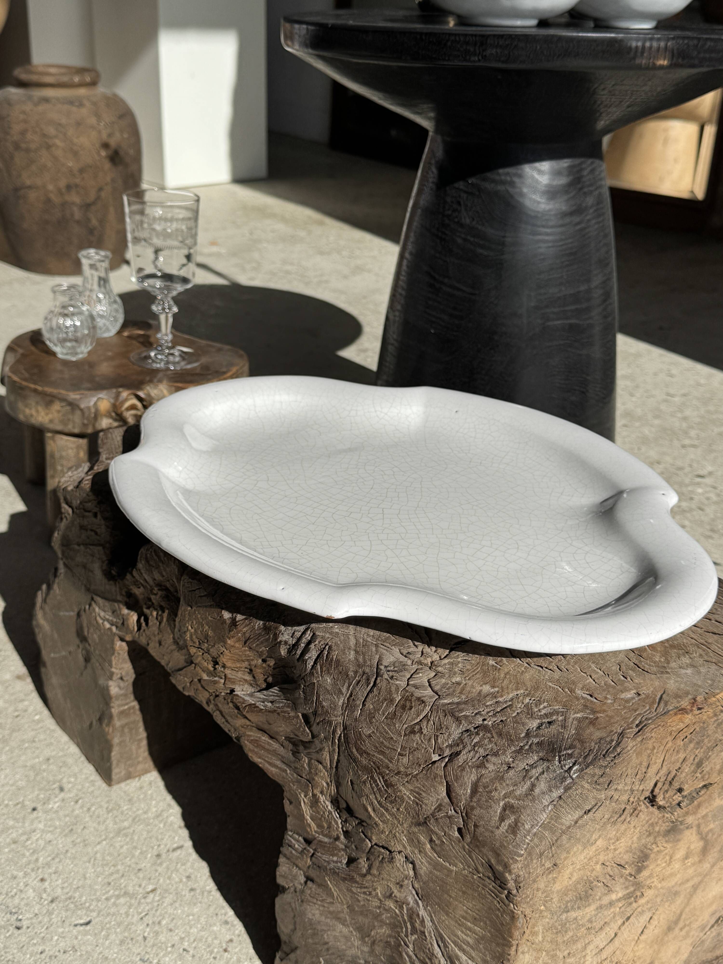 Antique oval-shaped white crackled faience plate with a scalloped edge.