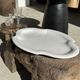 Antique oval-shaped white crackled faience plate with a scalloped edge.