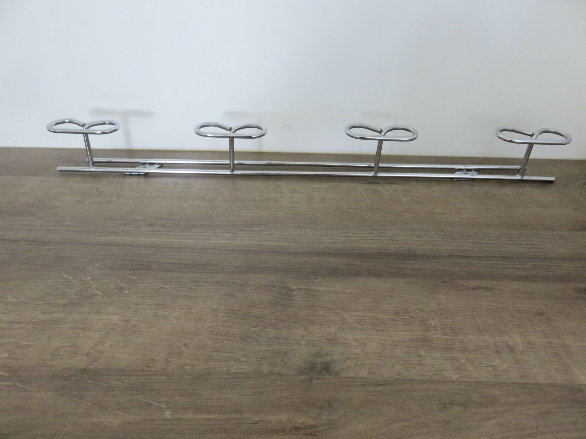 Large vintage wall-mounted coat rack in chrome metal