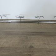 Large vintage wall-mounted coat rack in chrome metal