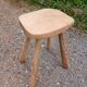 Antique stool in raw wood