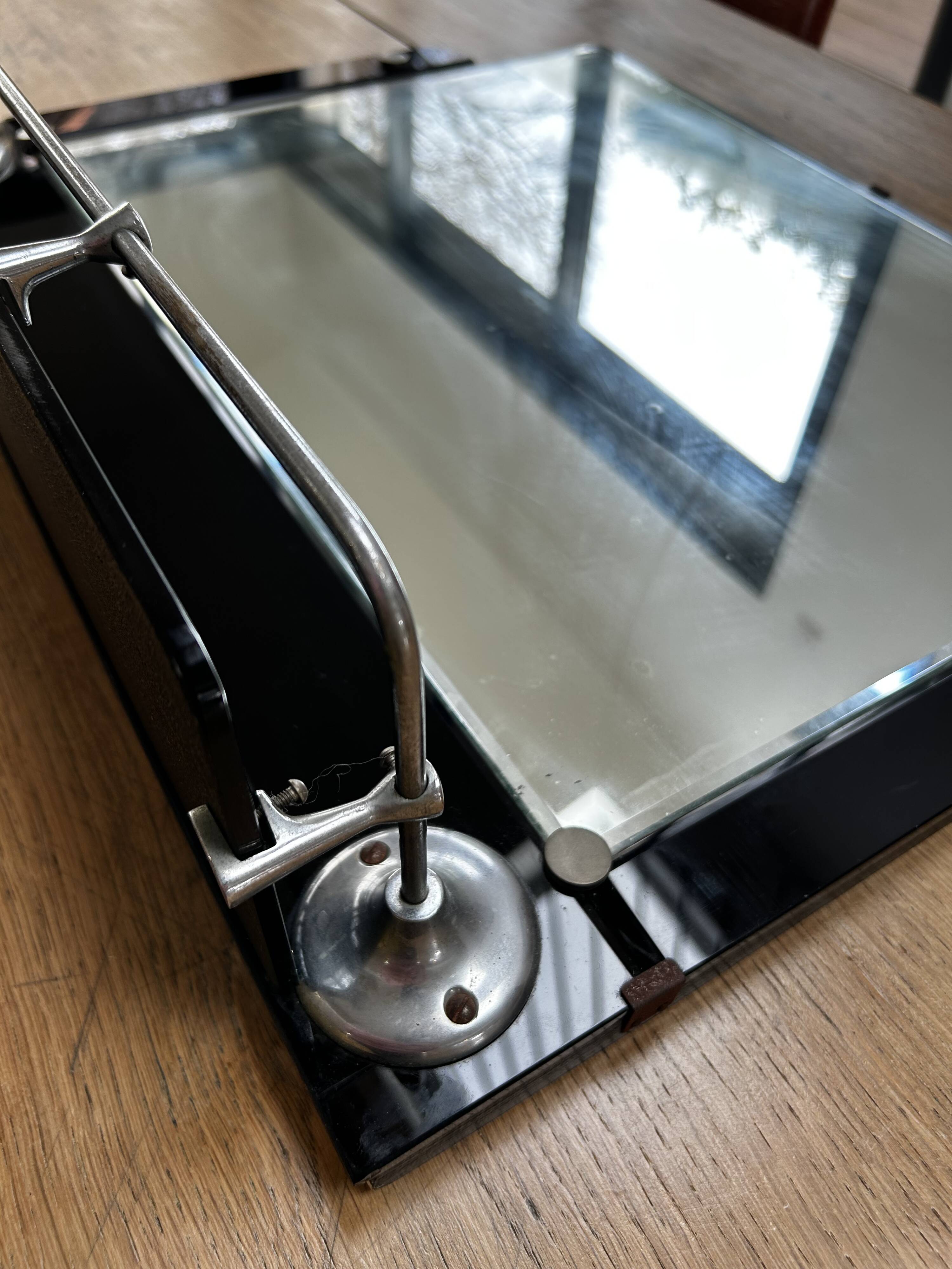 Vintage black mirror from the 1930s/40s with shelf.