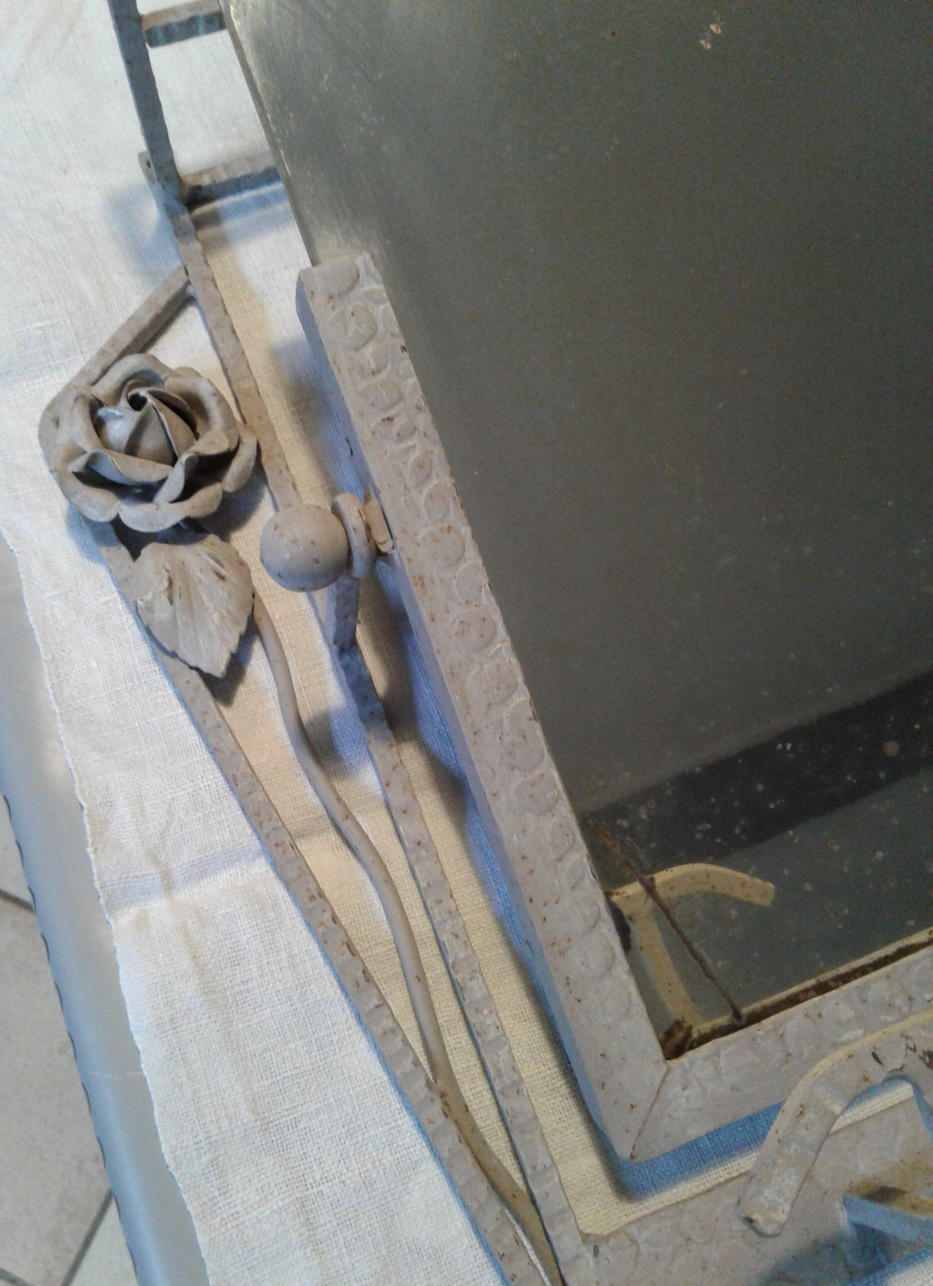 Former Wall coat hangers painted in gray iron