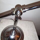 Articulated chromed metal lamp