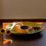 Old dish in sunflower slurry