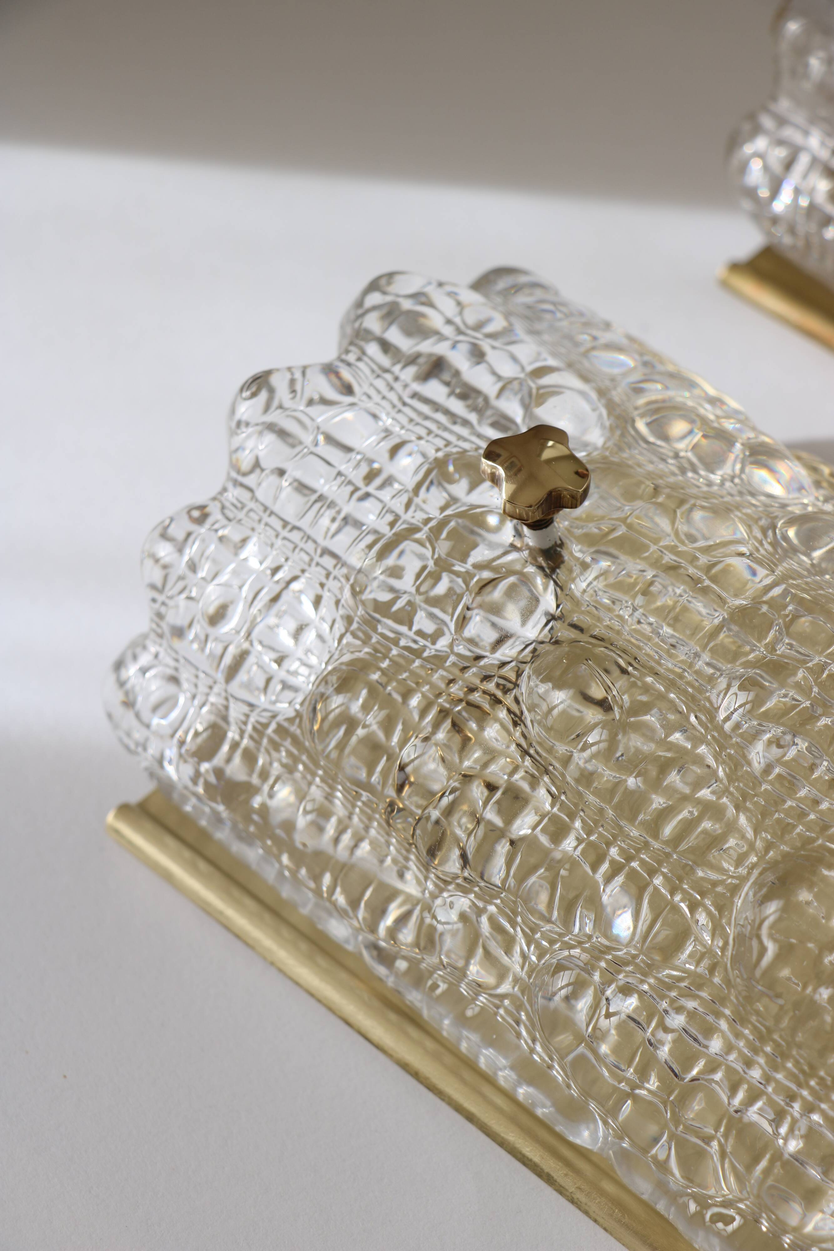 Pair of glass and brass wall lights by Carl Fagerlund for Orrefors, 1960.