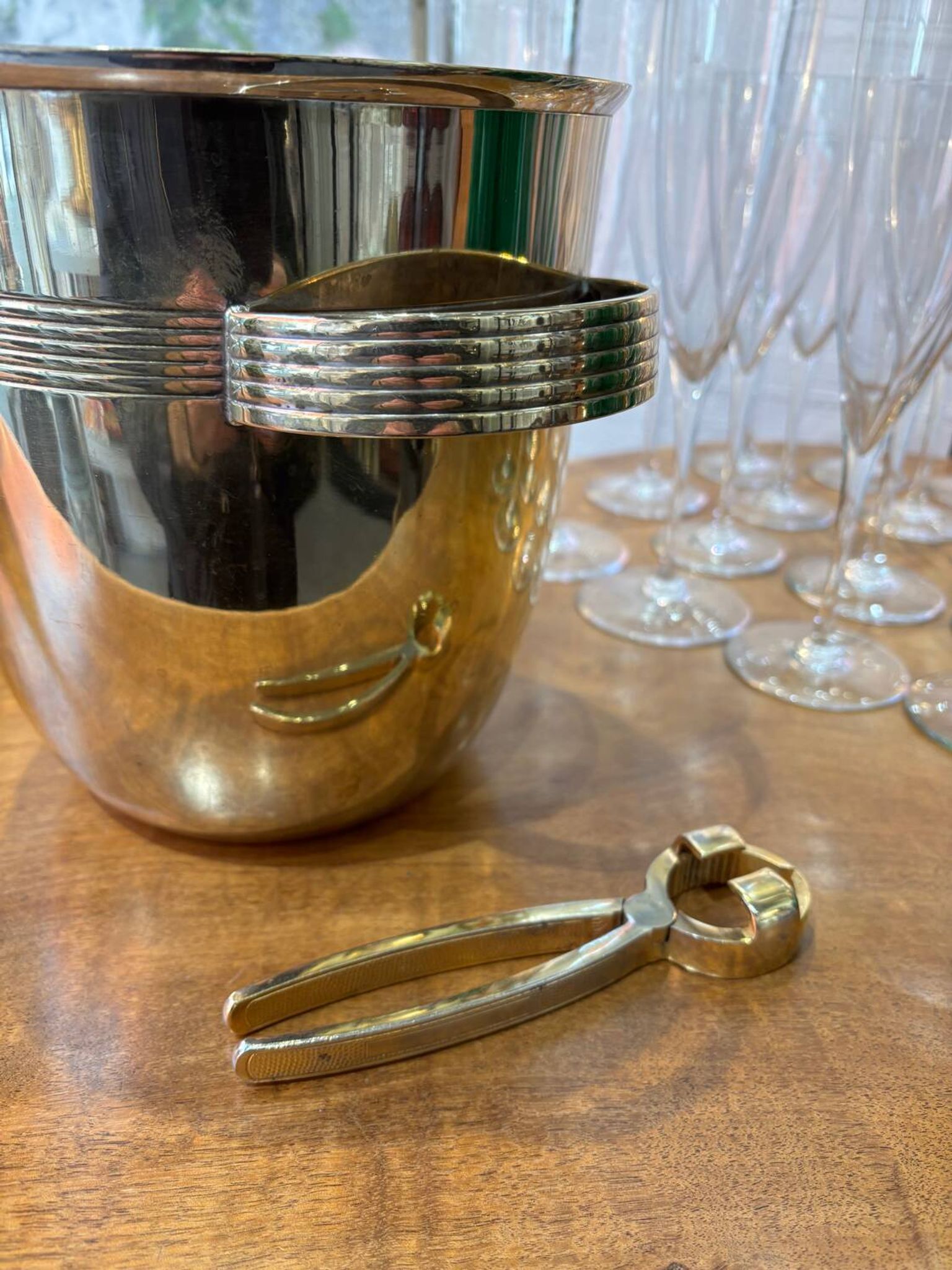 Alpaca champagne bucket from the 1920s with its monopole tongs.
