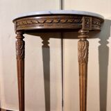Half-moon console in Louis XVI style made of carved wood.