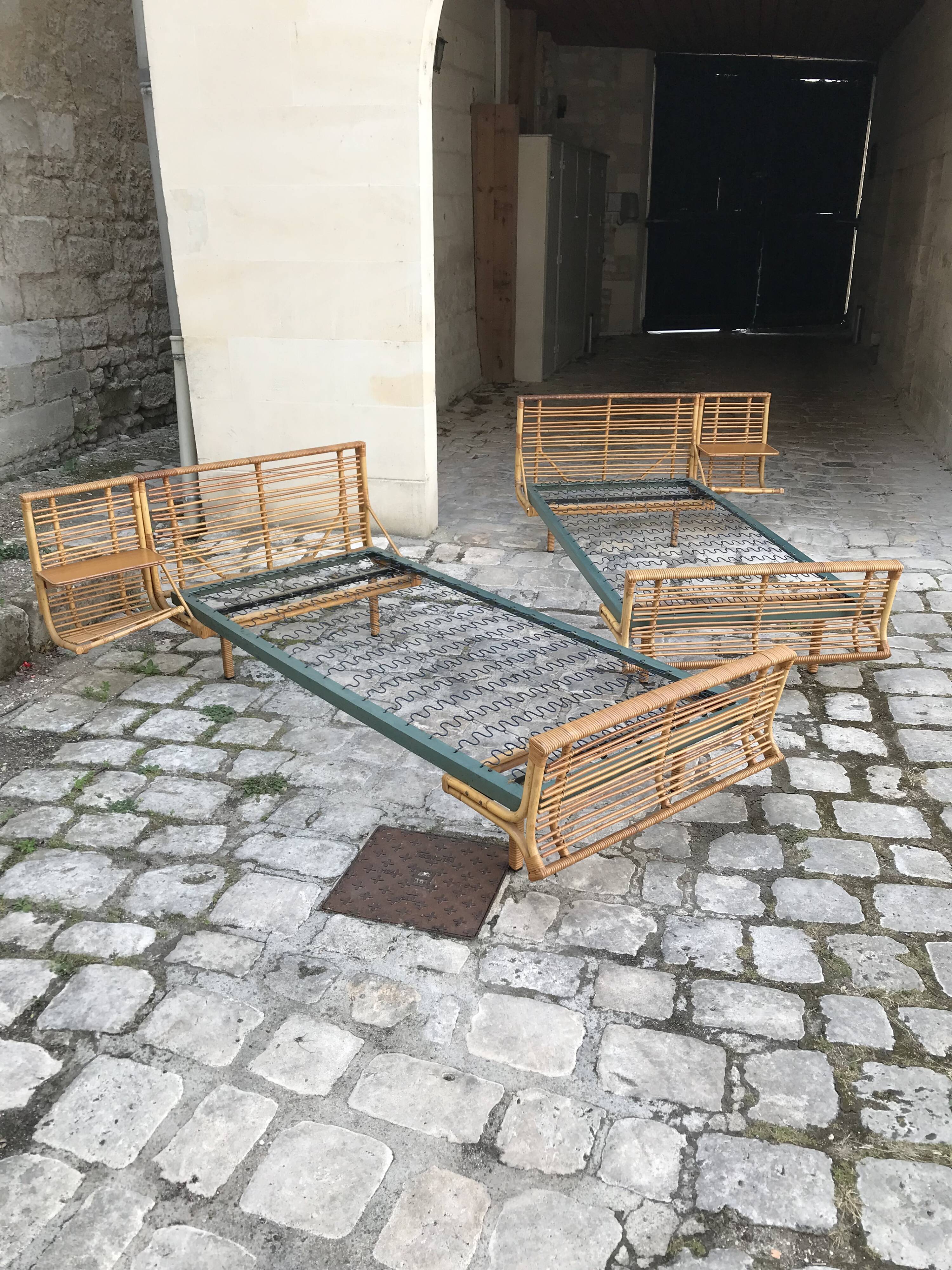Twin rattan beds with built-in bedside tables