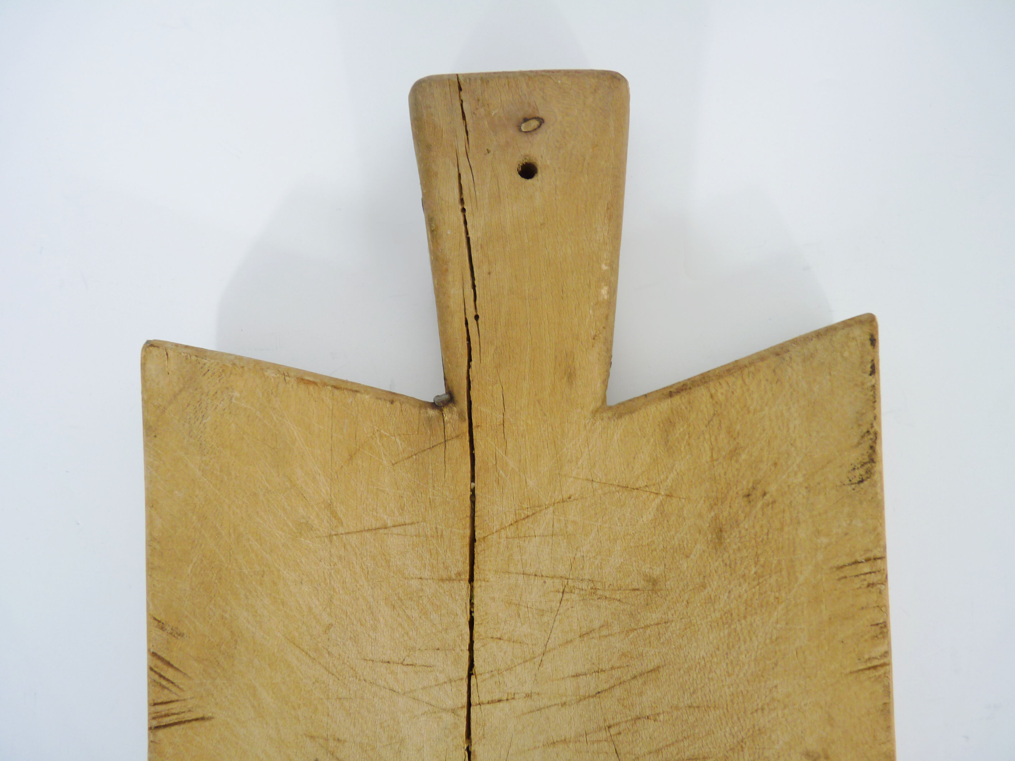 Small and old wooden cutting board. Year 50