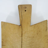 Small and old wooden cutting board. Year 50