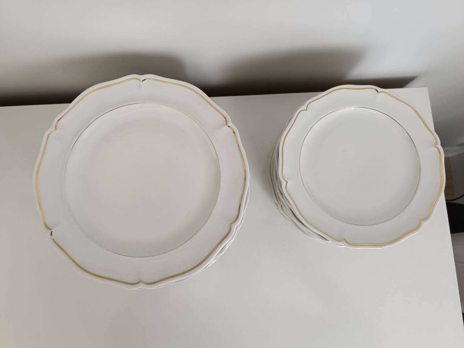 Set of Limoges porcelain flat and dessert plates