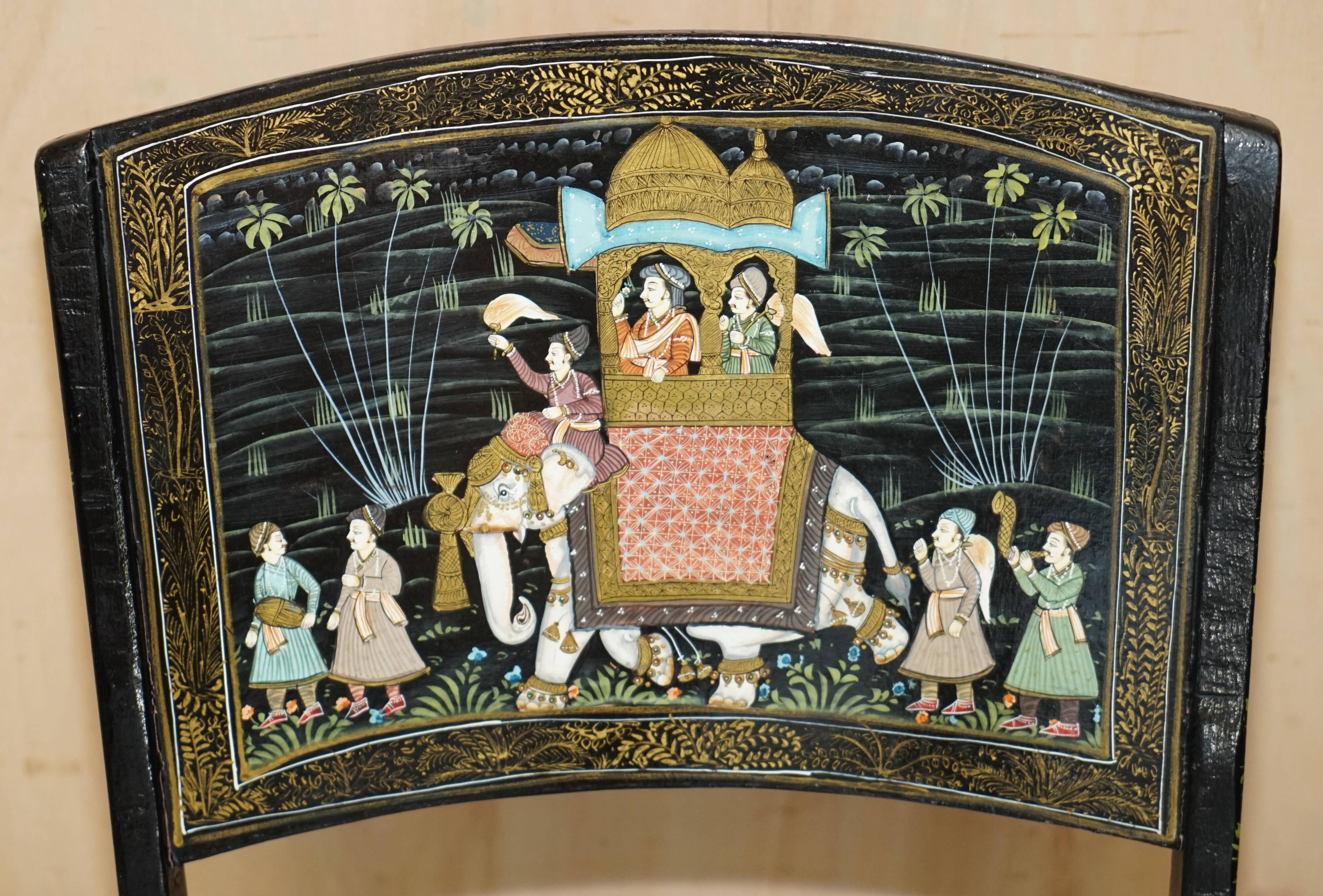 Pair of military folding chairs with Indian decoration.